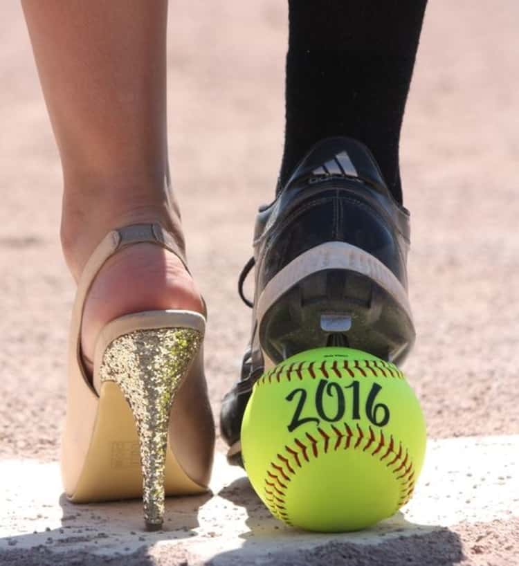 senior picture ideas for girls - girl's feet in high heel and cleat 