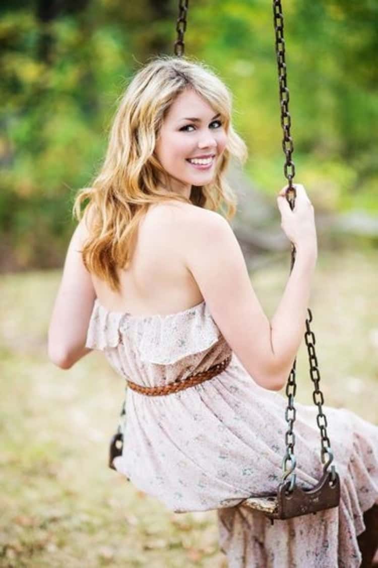 senior picture ideas for girls - smiling girl on swing 
