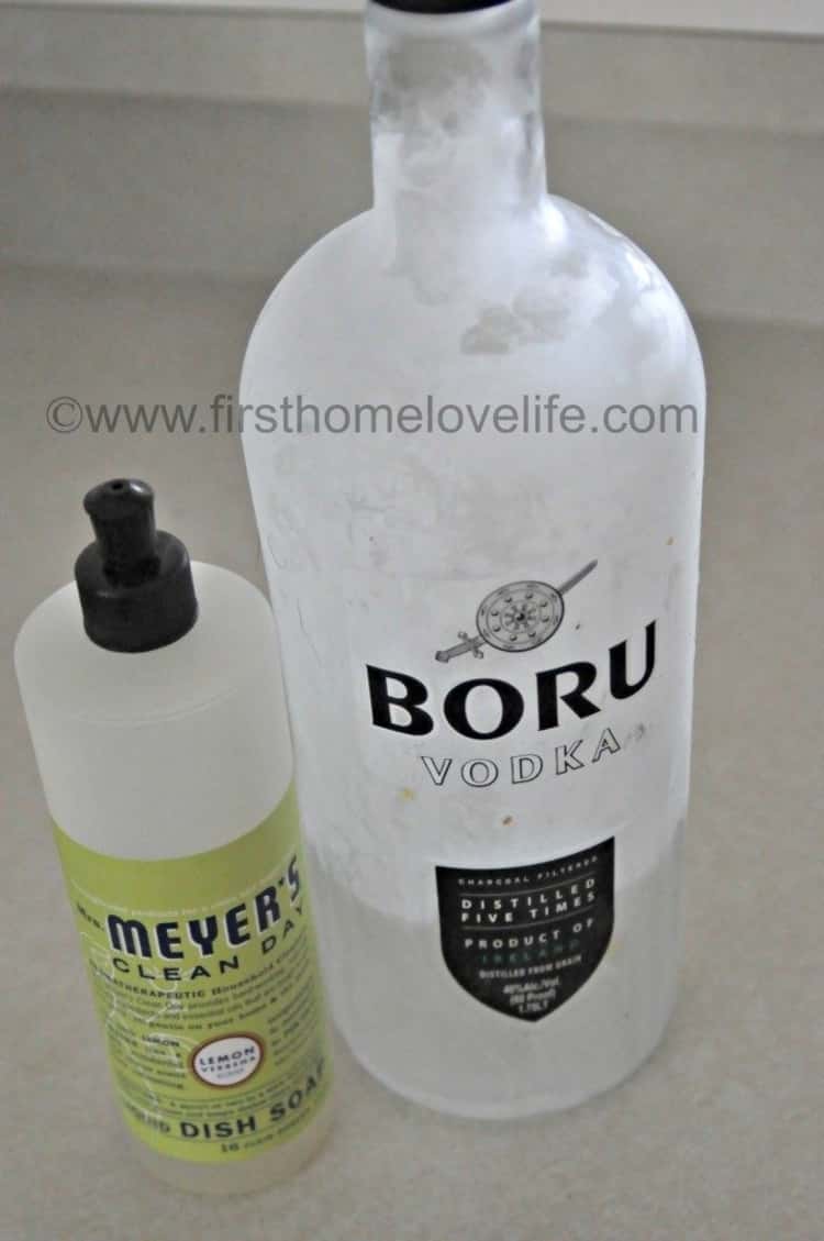 bottle of Meyers Clean Day next to bottle of Boru Vodka placed on an off-white surface