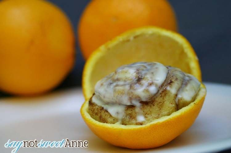 cinnamon buns cooking in an orange peel