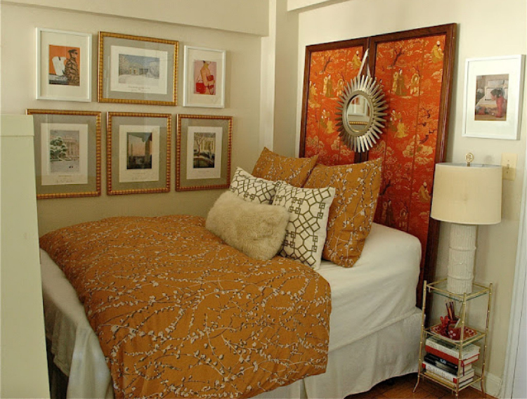 a decorative divider used as a headboard in an apartment