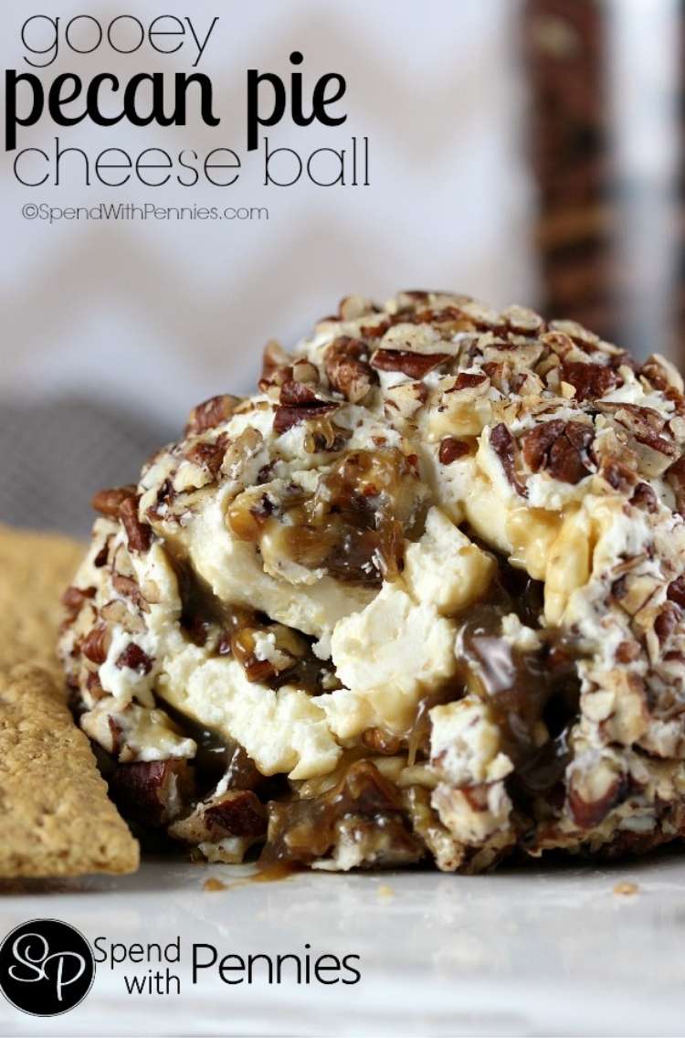 Pecan pie cheeseball with cream cheese swirls and topped with pecans