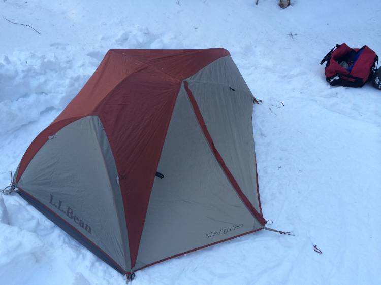 cold-weather-camping image of a tent in the snow