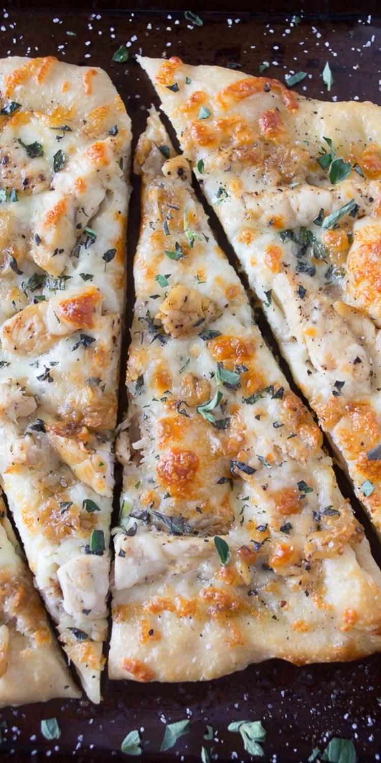 Pizza topped with caramelized garlic and roasted chicken. Easy gourmet pizza.