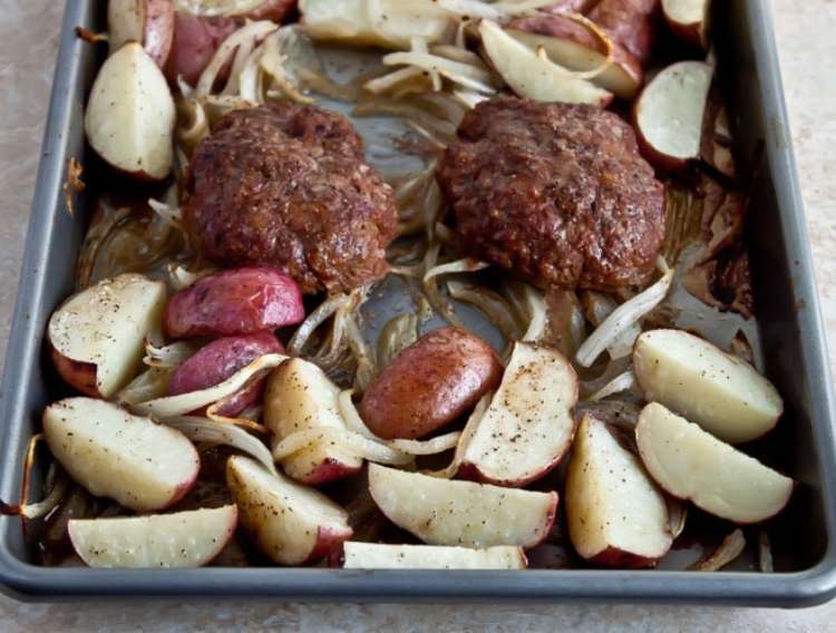 Beef sheet pan meal: Salisbury steak, potatoes, and onions