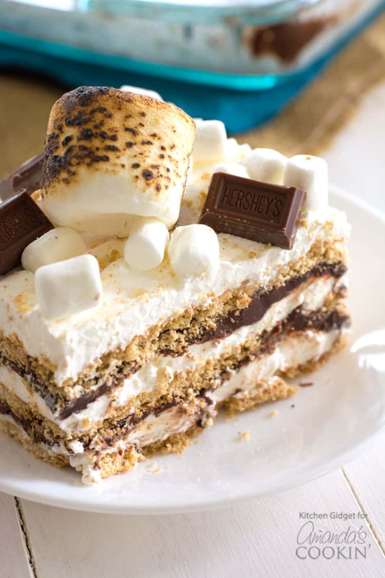 Smores icebox cake topped with smores, marshmallows and a piece of chocolate 