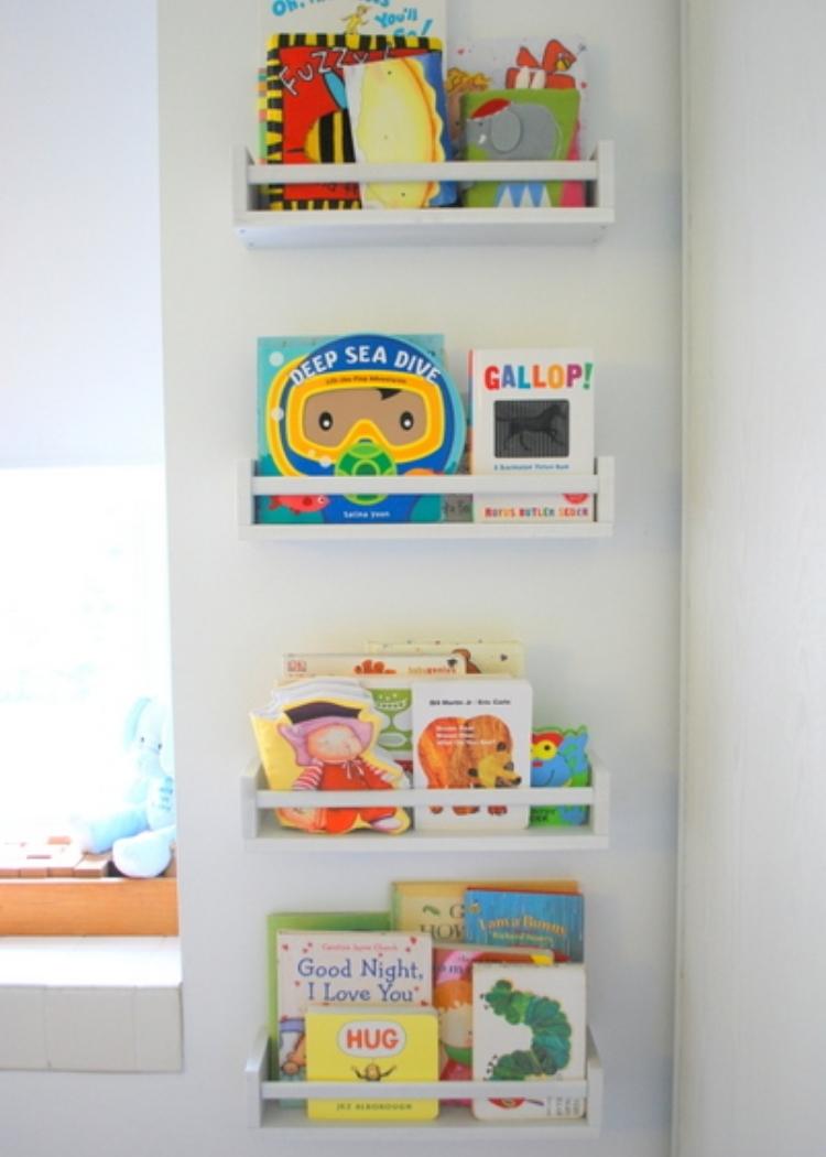 spice racks mounted to walls used to display books 