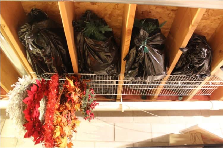 basement organization tip store bulky lightweight items on the ceiling