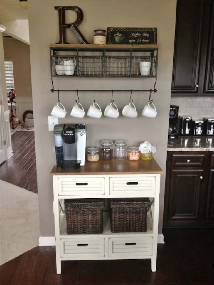 coffee organization center with wooden shelves, hanging cups on hooks, coffee machine cupboard