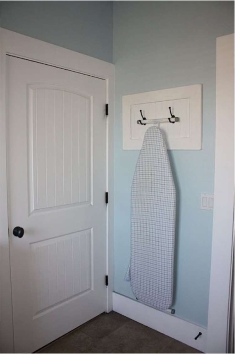 ironing board hanging on wall