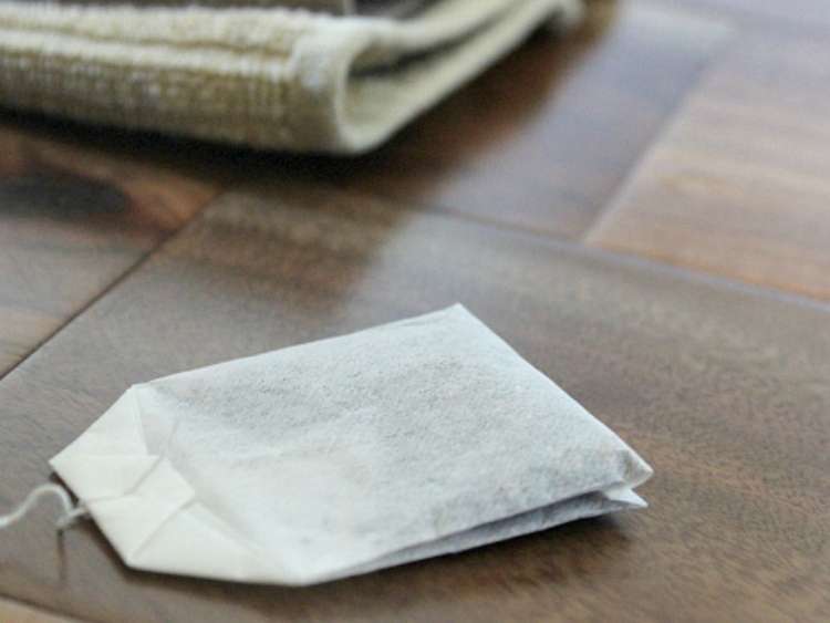 tea bag on wood floor