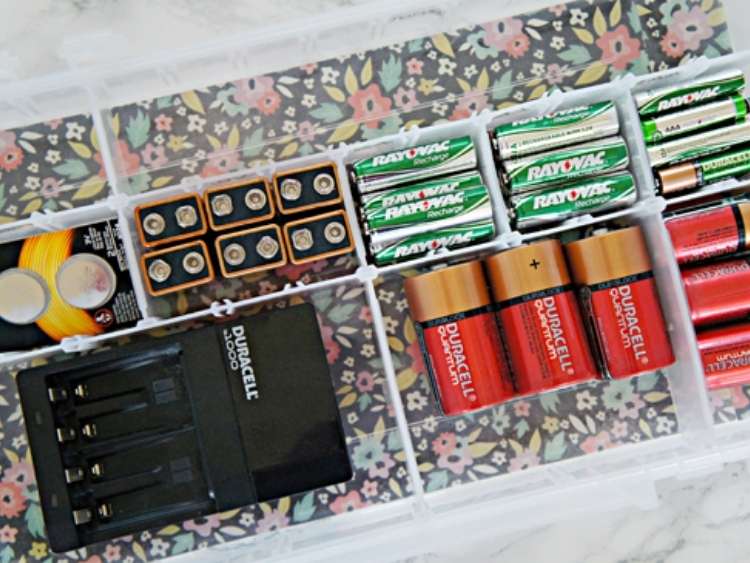 plastic storage compartment with batteries