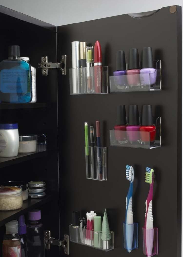 medicine cabinet organized with clear acrylic shelves attached to the inside door