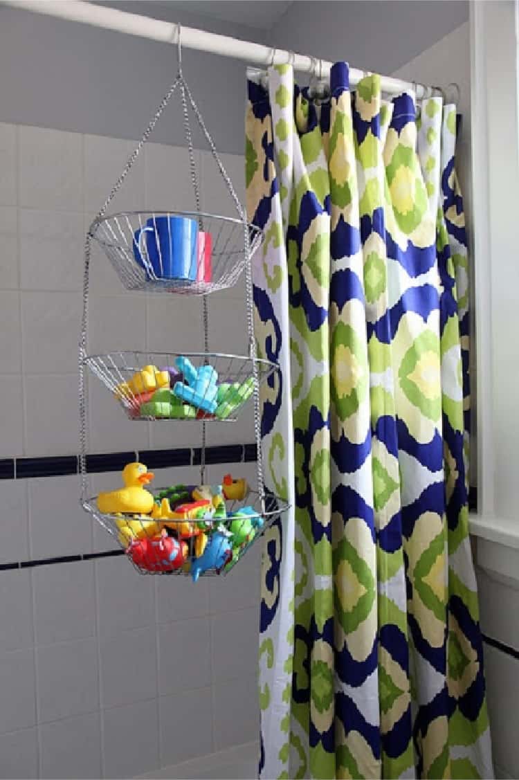a hanging fruit basket on a shower curtain rod