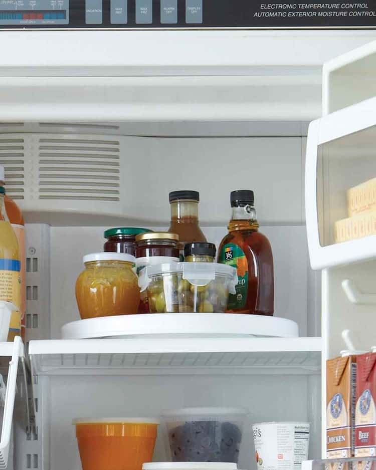 15 Life-Changing Fridge Organization Hacks - Organize your fridge space by placing condiments on a lazy Susan