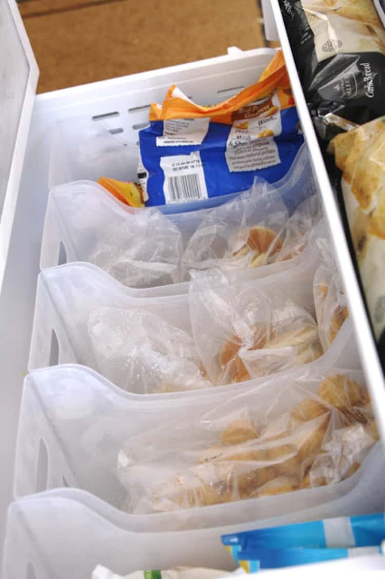 15 Life-Changing Fridge Organization Hacks - Use storage bins for freezer organization