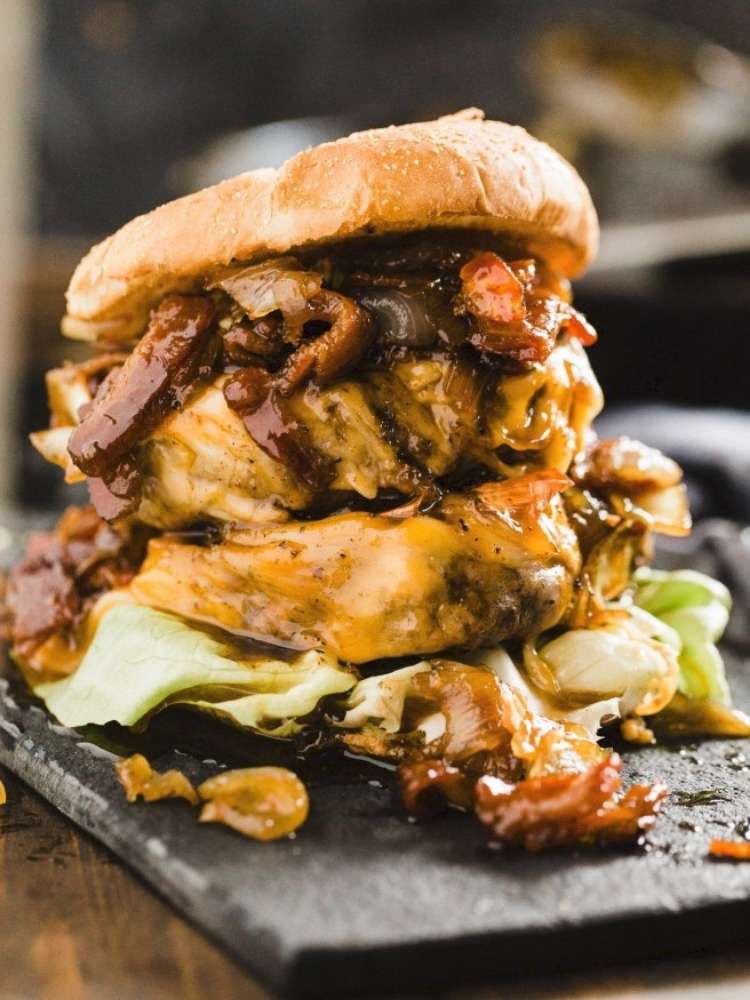 Double cheeseburger topped with cheddar, lettuce, fried onions and mushrooms.