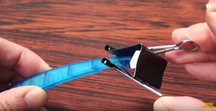 Binder clip over razor to protect clothes