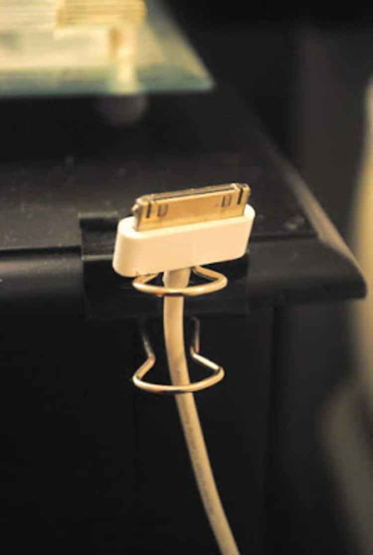 Using a file binder clip to hold a charging cord