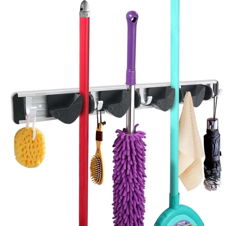 Broom wall rack with extra hooks