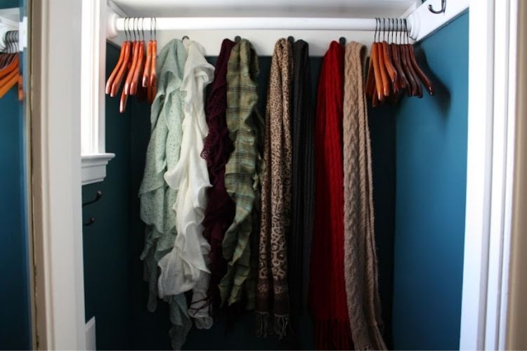 Coat Closet Organization Ideas - Use large hooks to organize scarves