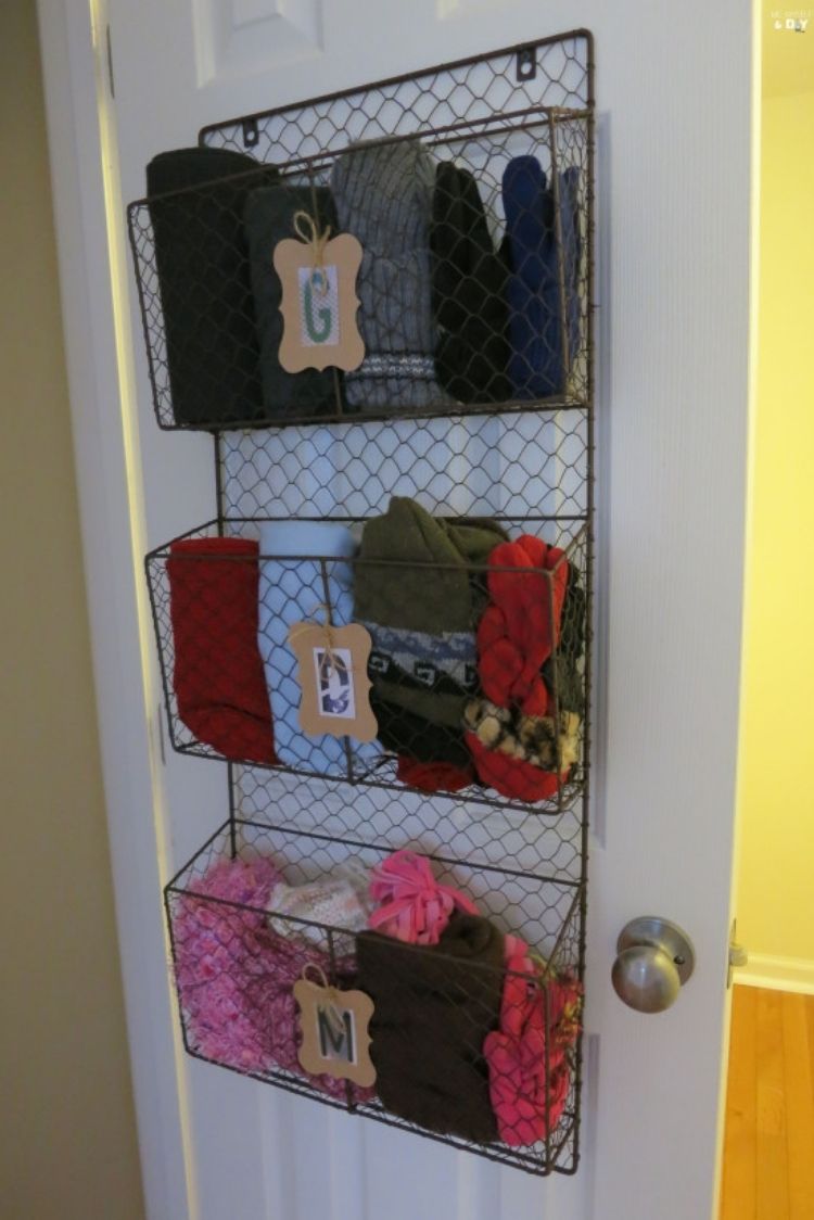 Coat Closet Organization Ideas - Hang magazine baskets to organize small items like children's winter wear