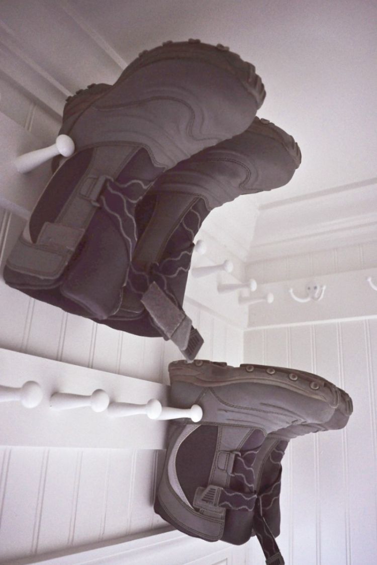 Coat Closet Organization Ideas - Install shoe pegs inside the coat closet