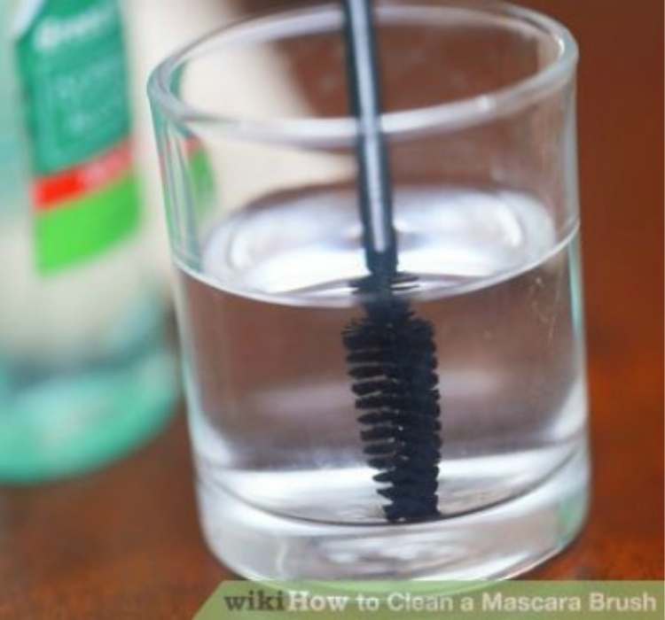Picture of mascara brush being washed properly