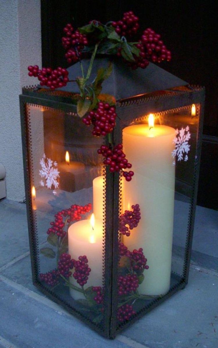 Christmas porch lantern with lit candles inside