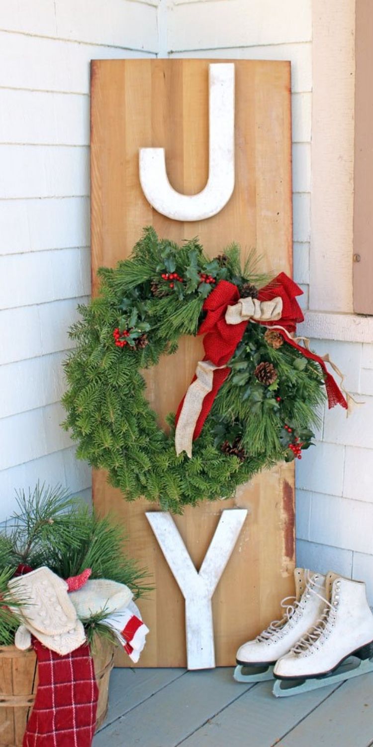 Joy porch sign with wreath and sakes