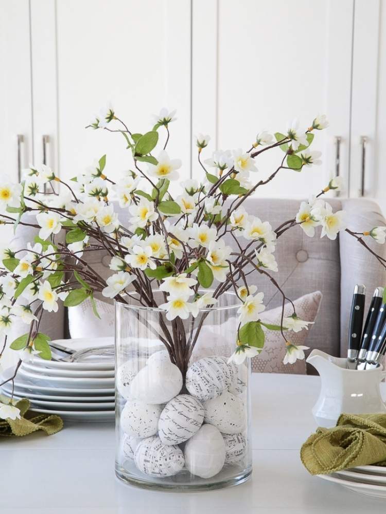 Picture of eggs wrapped in French script paper and music notes filling vase