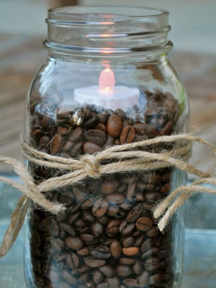 Picture of coffee beans in vase with candle