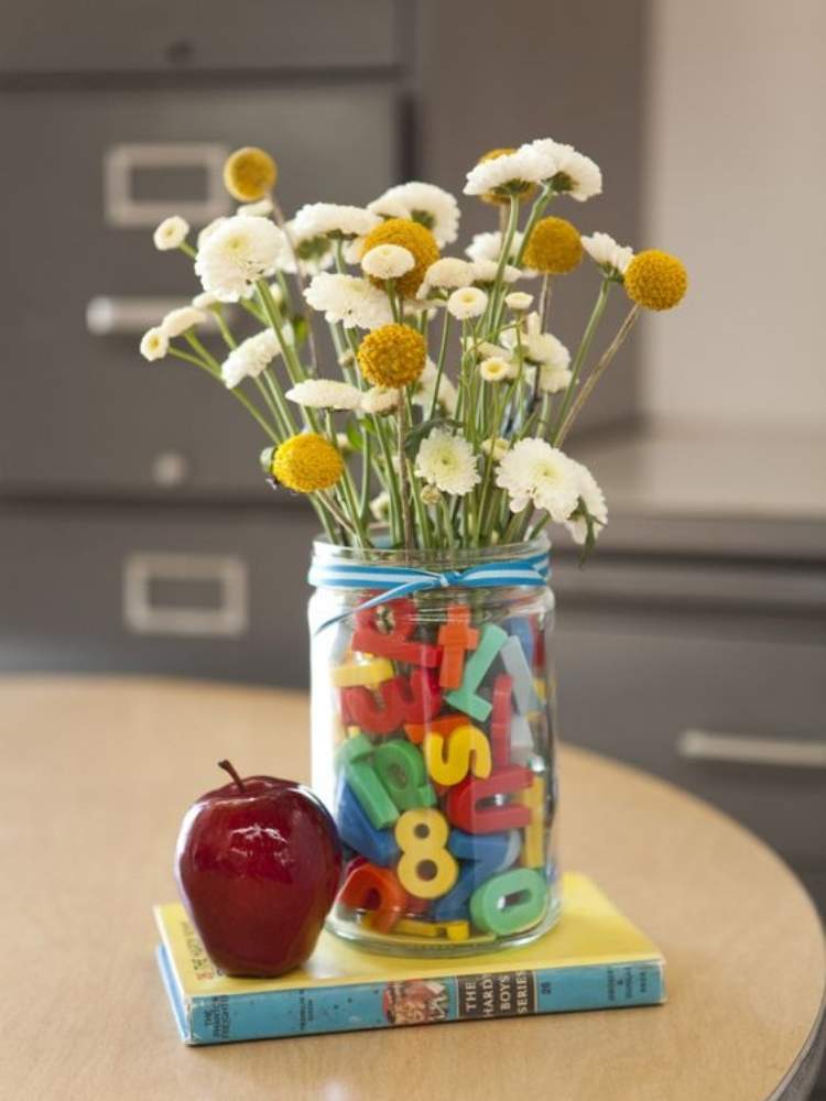 Picture of vase filled with wooden and magnetic alphabet 