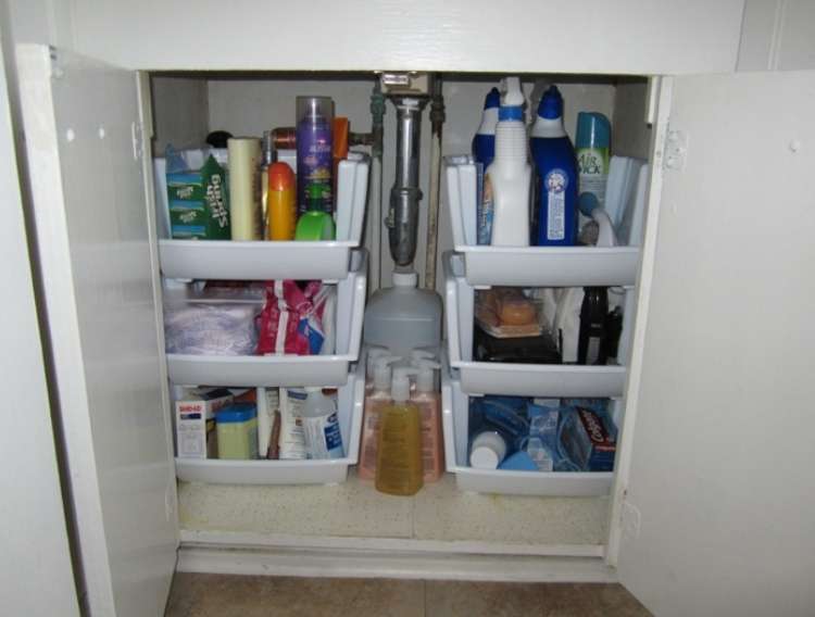 OneCrazyHouse DIY Home Organization under the sink storage area organized with plastic containers as shelving