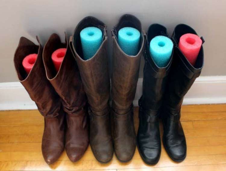 OneCrazyHouse DIY Home Organization leather boots with pieced of pool noodle cut to fit inside to prevent creases