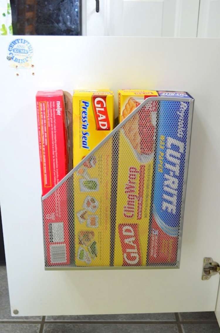 OneCrazyHouse DIY Home Organization magaznie holder attached to kitchen cabinet door with plastic wrap boxes neatly organized inside