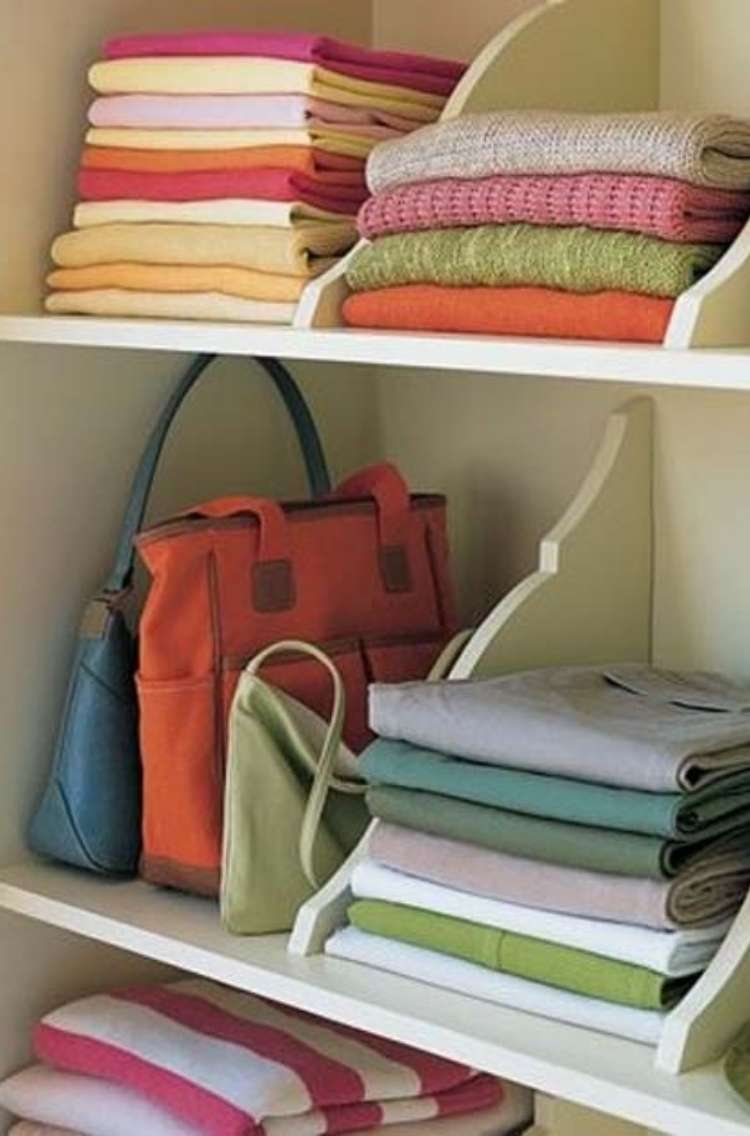 OneCrazyHouse DIY Home Organization shelves with dividers organizing different sections, with purses, sheets and pilllwcases