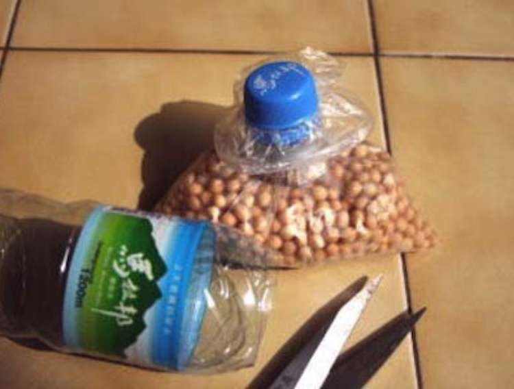 OneCrazyHouse DIY Home Organization popcorn kernels being stored in plastic bag with plastic bottle topper for easy storage and dispensing