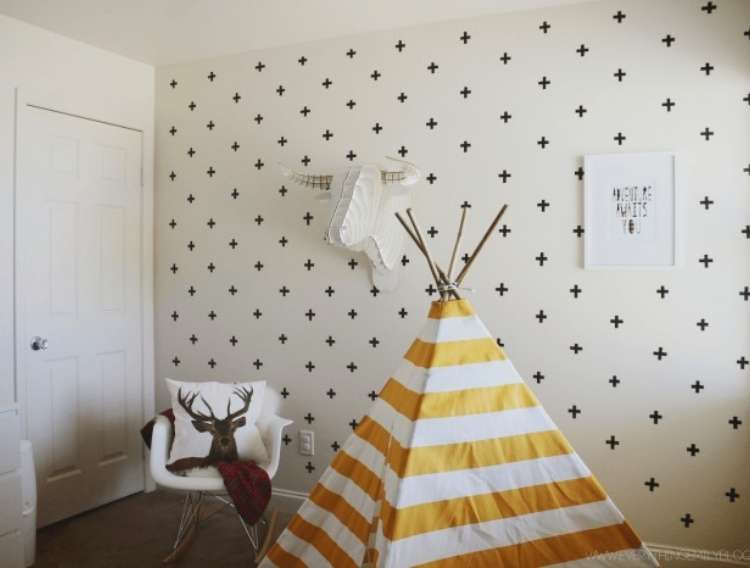 OneCrazyHouse Dorm Room Decor wall decorated with washi tape crosses with clother Teepee and seat in the room in fron't of the wall