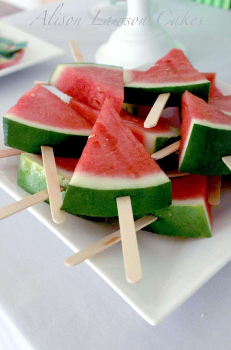 OneCrazyHouse Party Foods Plate with a pile of watermelon slices on wooden sticks