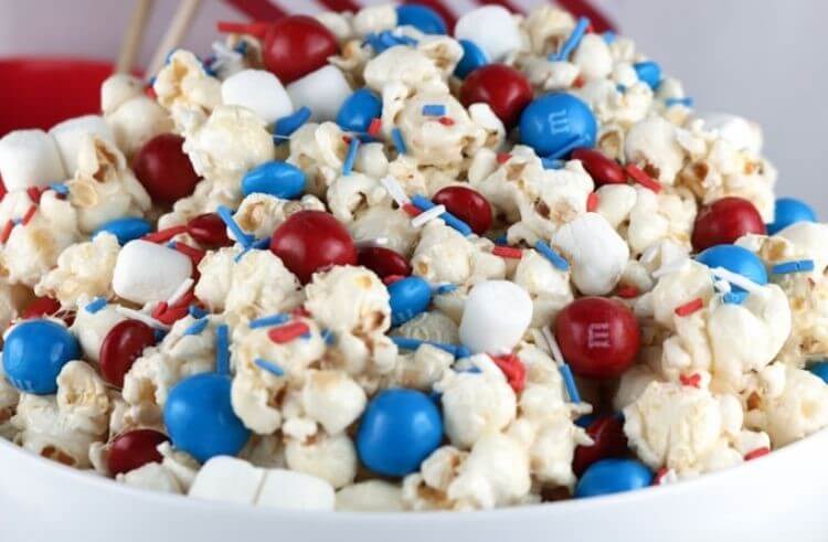 Popcorn with red, white, and blue M&Ms and sprinkles - a 4th of July food idea