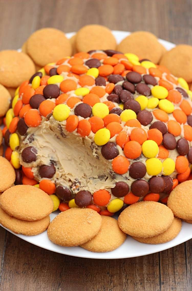 Reese peanut butter cheeseball- on a plate with circle wafers