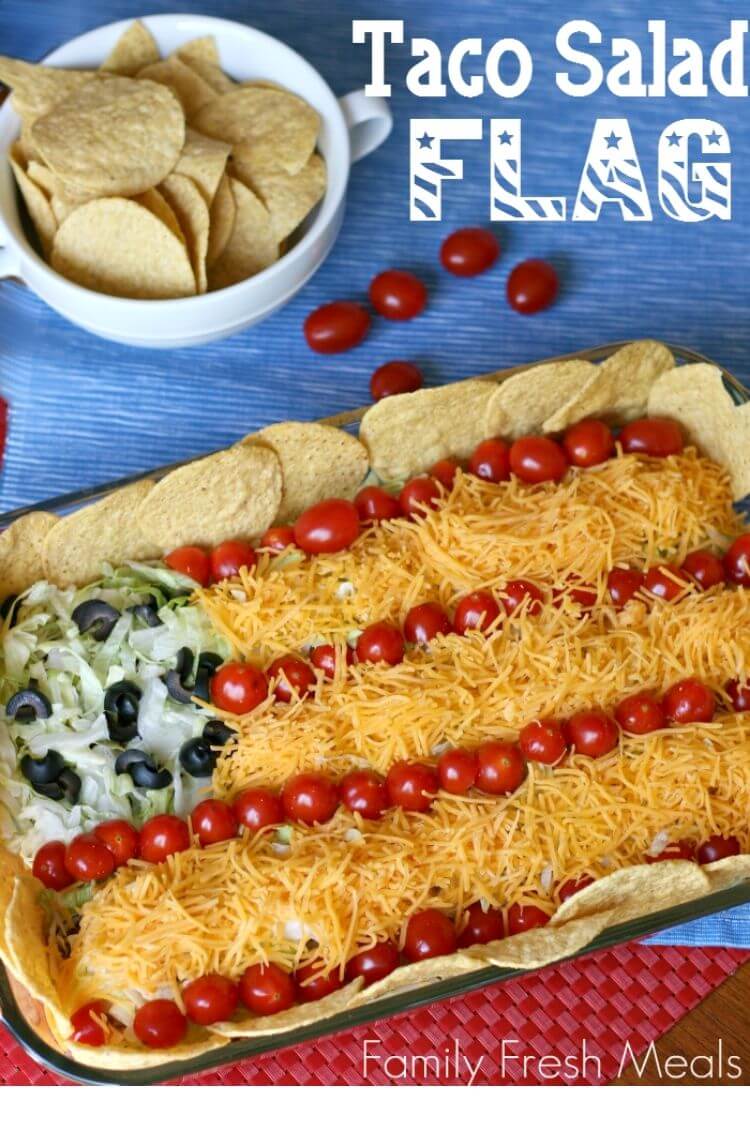 A 4th of July food idea - taco salad in a sheet pan with chips around the edges to look like a flag