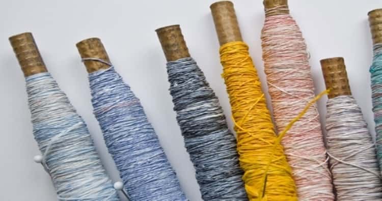 Plastic bags repurposed and spun into thread to be used for weaving 