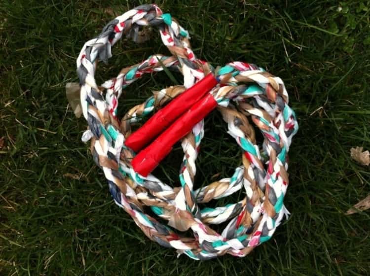 A jump rope made from plastic bags cut and braided together