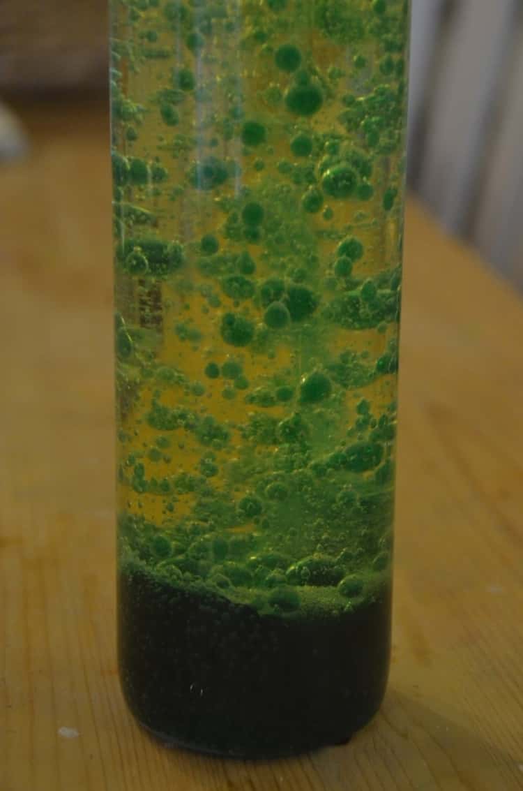 A photo of a DIY lava lamp made from water, oil, food coloring and alka-seltzer