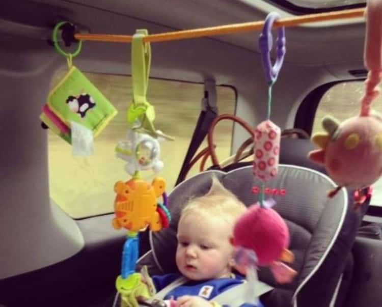 toddler activity center made using a bungee cord