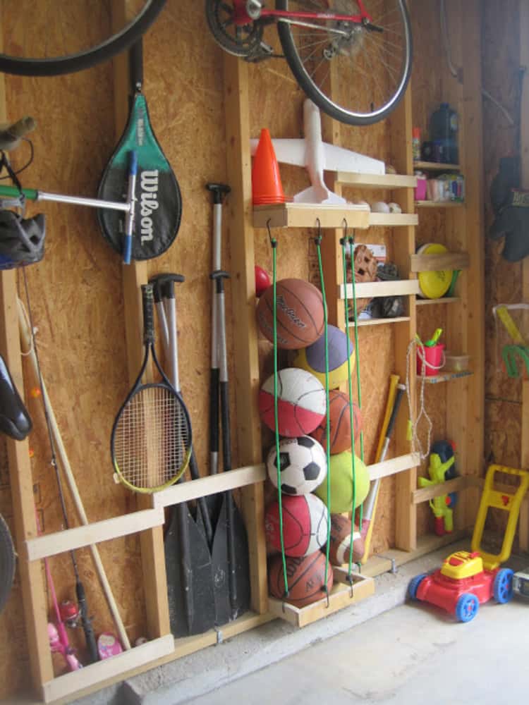 balls organized with bungee cords between studs and a ball organizer