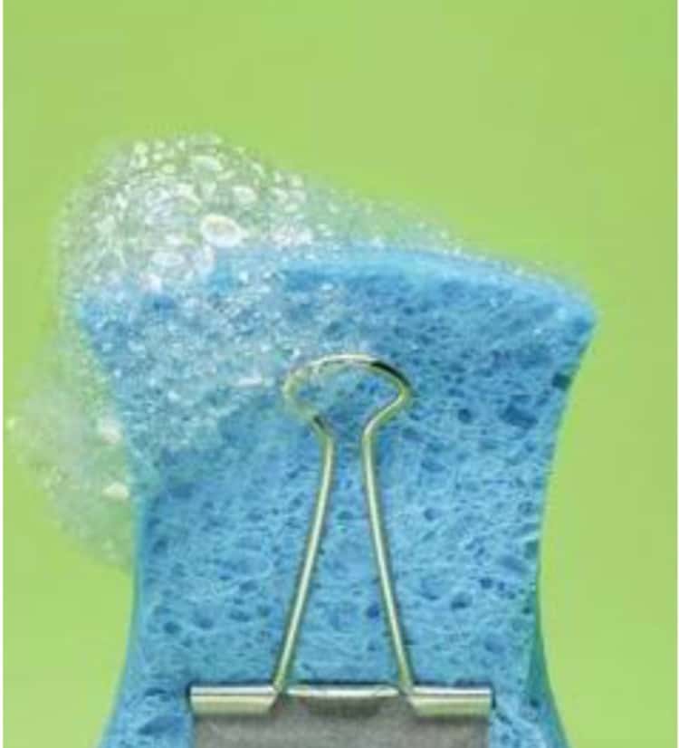 Use a binder clip to hold your sponge upright for faster drying