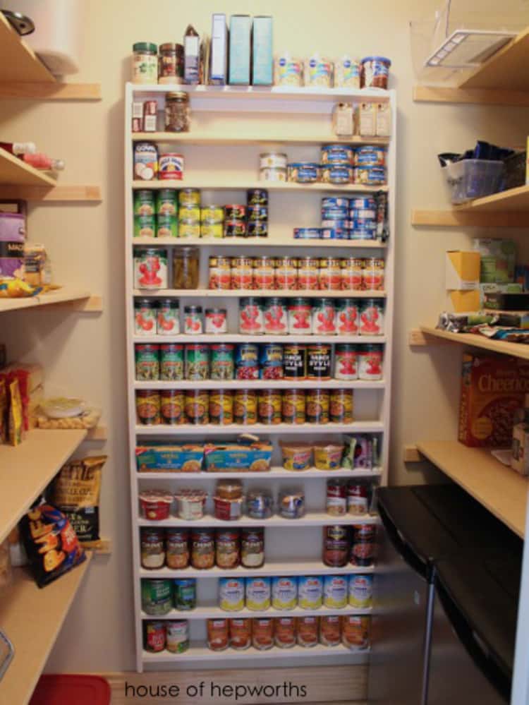 canned food storage wall on the back wall of the pantry with canned goods on it